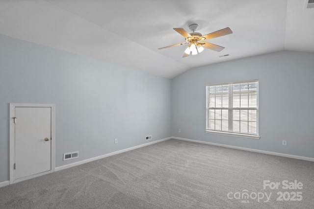 unfurnished room with lofted ceiling, carpet, and ceiling fan