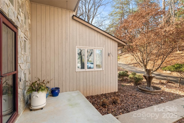 view of property exterior featuring a patio area