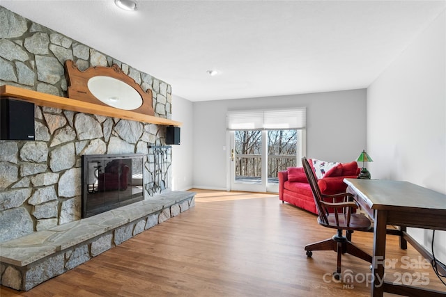 living room featuring hardwood / wood-style floors and a fireplace