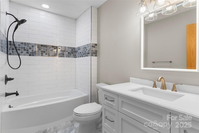 full bathroom featuring vanity, toilet, and tiled shower / bath combo