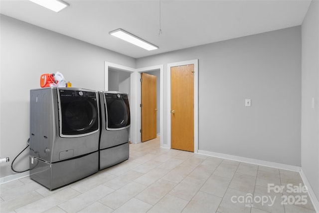 washroom featuring washer and clothes dryer