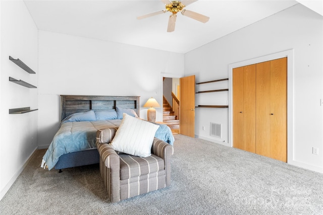 bedroom featuring ceiling fan and carpet