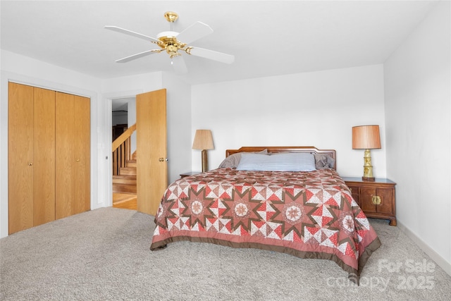 bedroom with light colored carpet, a closet, and ceiling fan