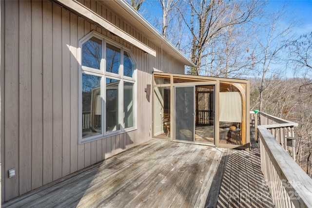 wooden terrace with a sunroom