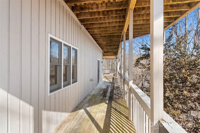 view of property exterior featuring a wooden deck