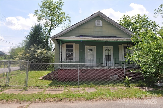 529 Gage St, Chester, SC 29706 - view of front of property with covered porch, a fenced front yard, and a gate