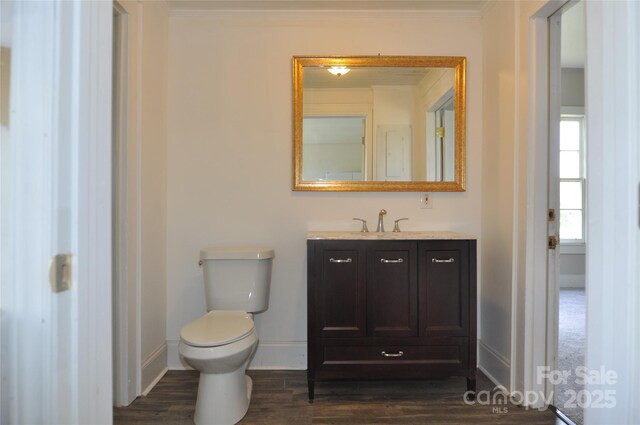 529 Gage St, Chester, SC 29706 - bathroom featuring baseboards, vanity, wood finished floors, toilet, and crown molding