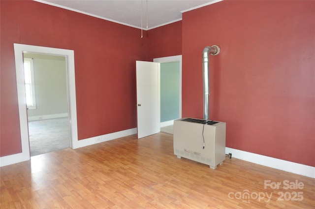 529 Gage St, Chester, SC 29706 - unfurnished room featuring heating unit, wood finished floors, baseboards, and crown molding