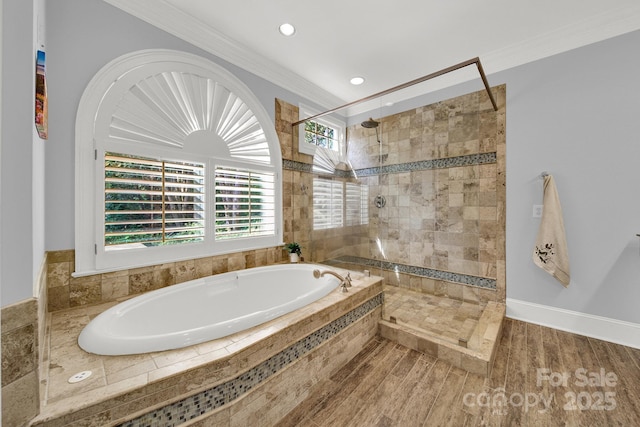 bathroom featuring crown molding, plus walk in shower, and hardwood / wood-style floors