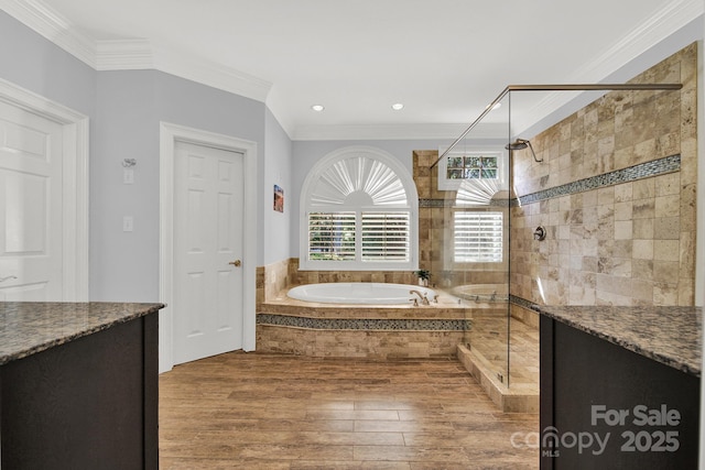 bathroom with vanity, shower with separate bathtub, hardwood / wood-style floors, and crown molding