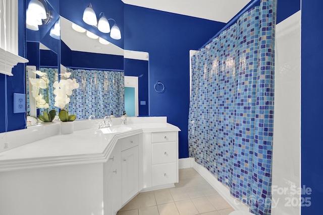 bathroom with tile patterned floors and vanity