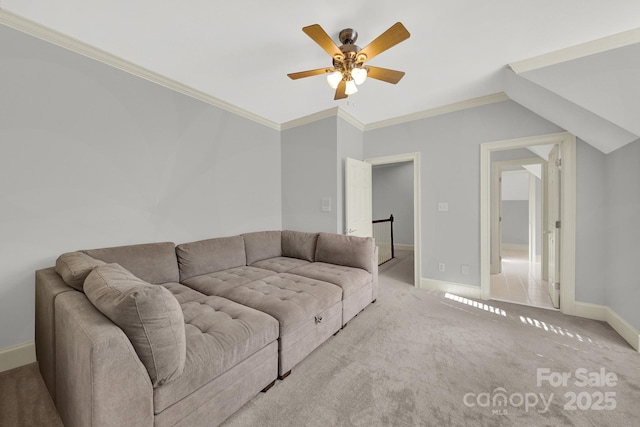 carpeted living room featuring ornamental molding and ceiling fan