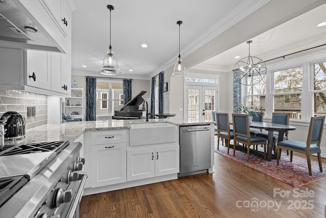 kitchen featuring french doors, stainless steel appliances, sink, and white cabinets