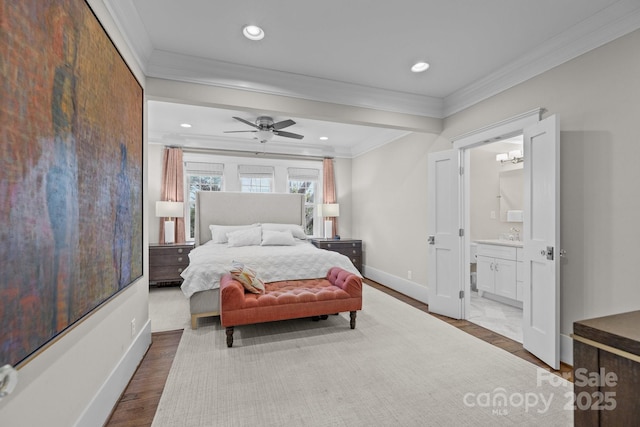 bedroom with ornamental molding, dark hardwood / wood-style floors, and ensuite bathroom