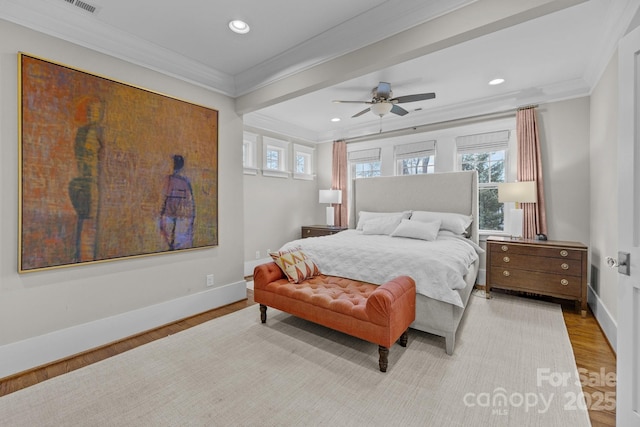 bedroom featuring crown molding, ceiling fan, and light hardwood / wood-style flooring