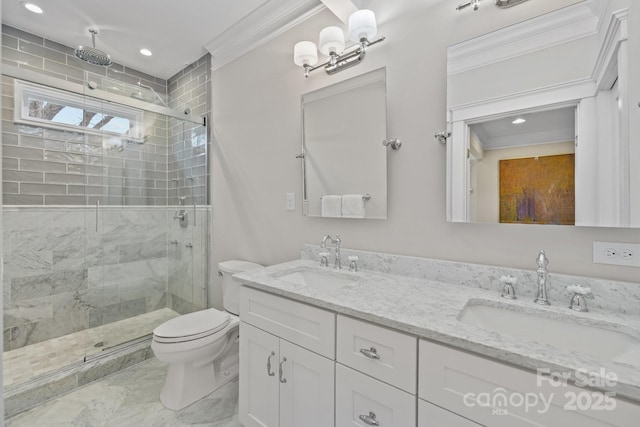 bathroom with toilet, ornamental molding, vanity, and a shower with shower door