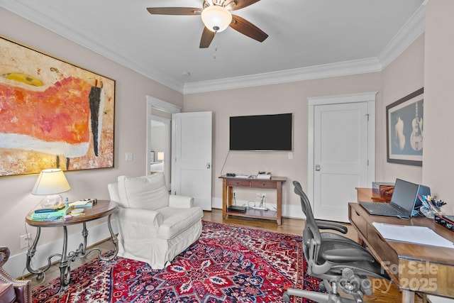 home office with hardwood / wood-style floors, ornamental molding, and ceiling fan