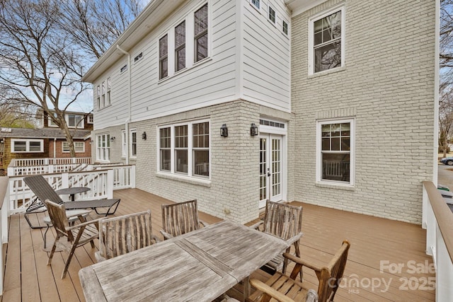 wooden terrace featuring french doors