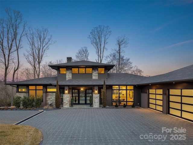 prairie-style house featuring a garage