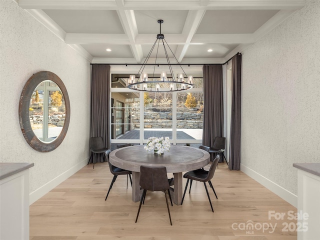 dining room with beamed ceiling, coffered ceiling, and light hardwood / wood-style flooring