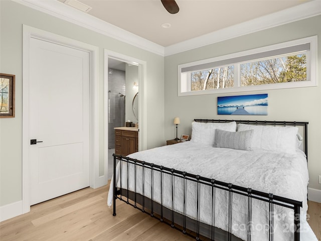 bedroom with ornamental molding, ensuite bath, and light hardwood / wood-style flooring