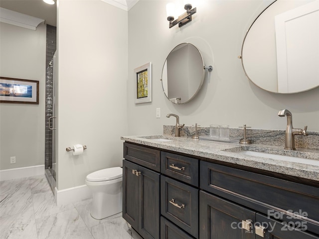 bathroom featuring vanity, a shower with shower door, crown molding, and toilet