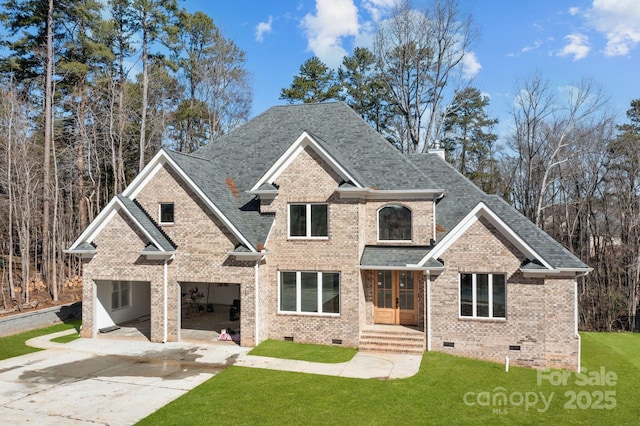 craftsman-style house featuring a garage and a front yard