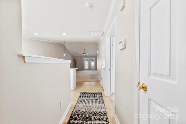 hallway featuring ornamental molding and french doors