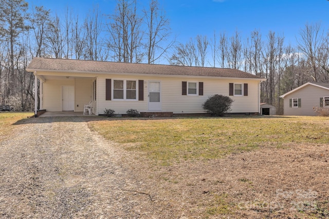 ranch-style home with a carport and a front yard