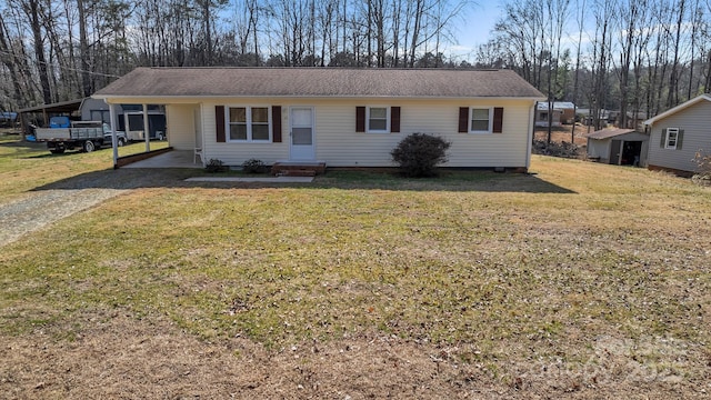 single story home featuring a carport and a front yard