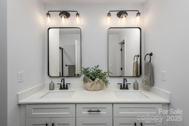 bathroom with double vanity and a sink