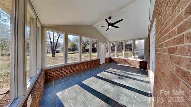 unfurnished sunroom featuring ceiling fan and vaulted ceiling with beams