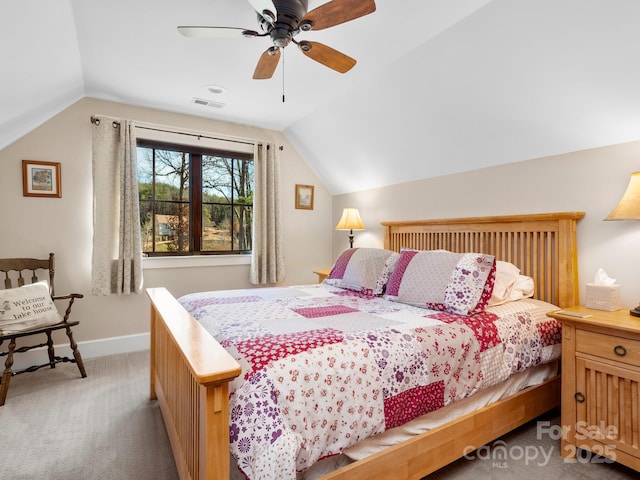 carpeted bedroom featuring ceiling fan and vaulted ceiling