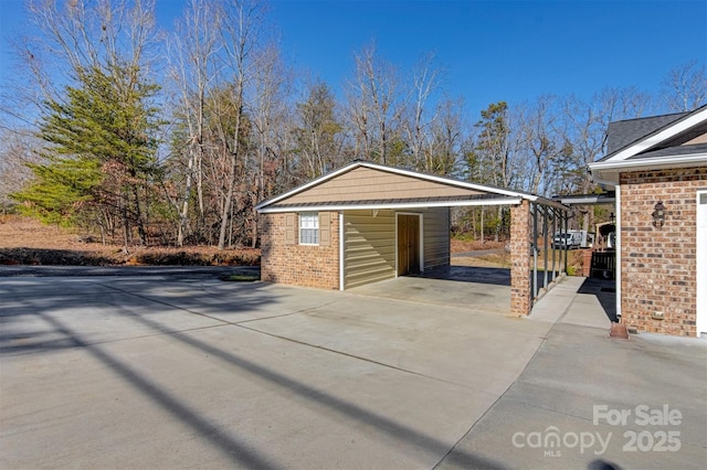 garage featuring a carport