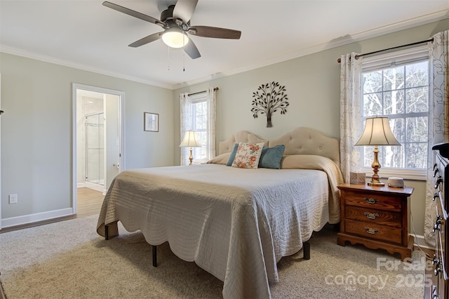 bedroom with ceiling fan, ornamental molding, and ensuite bathroom