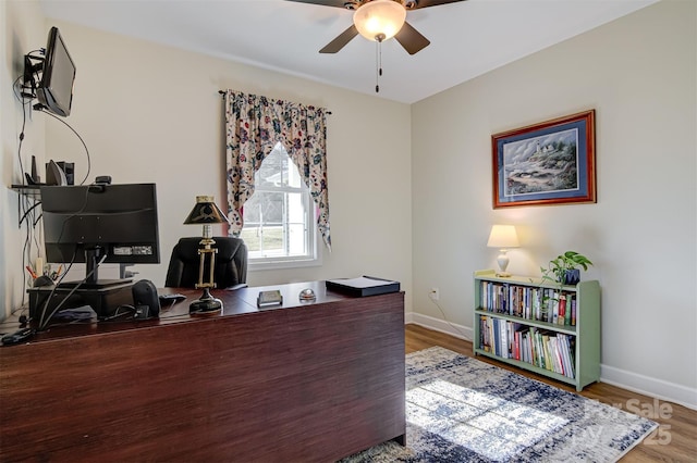 office area featuring wood-type flooring and ceiling fan