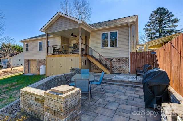 back of house with a patio and ceiling fan