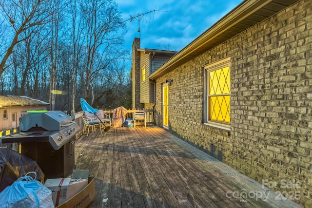 wooden deck with grilling area