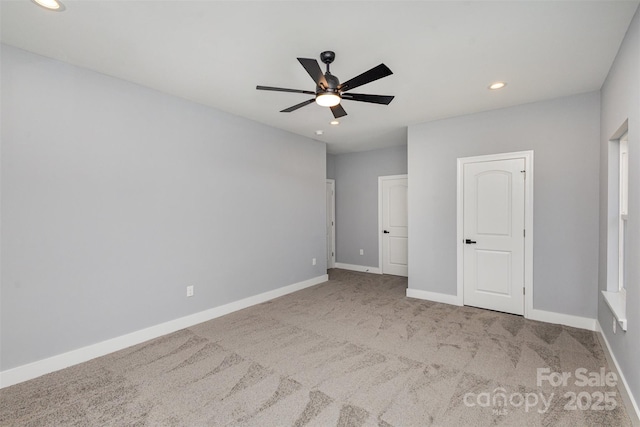 unfurnished bedroom featuring baseboards, recessed lighting, a ceiling fan, and carpet floors