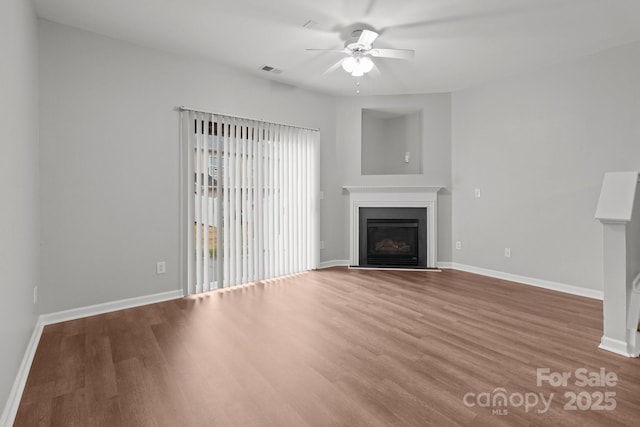 unfurnished living room with ceiling fan and light hardwood / wood-style flooring