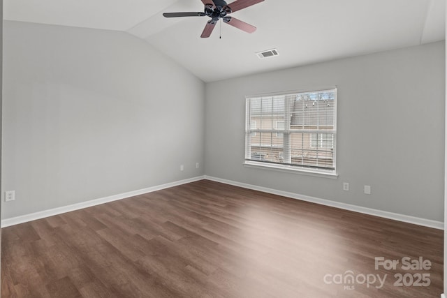 unfurnished room with ceiling fan, lofted ceiling, and dark hardwood / wood-style flooring