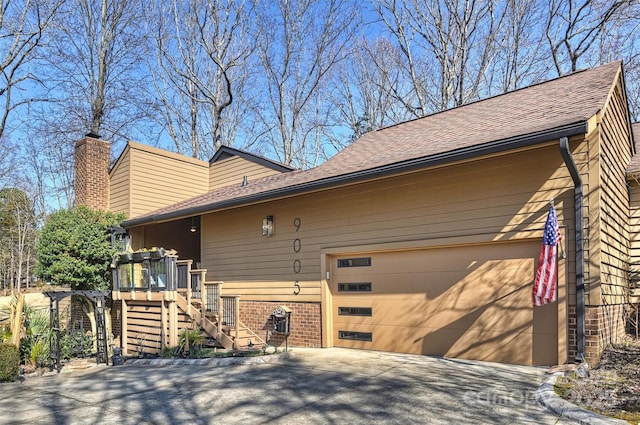 view of side of property featuring a garage