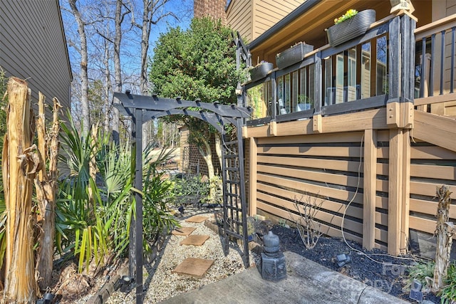 view of side of property with a pergola