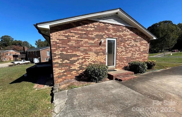 view of home's exterior featuring a yard