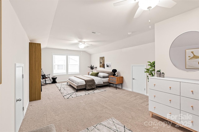 bedroom with lofted ceiling, visible vents, a ceiling fan, carpet floors, and baseboards