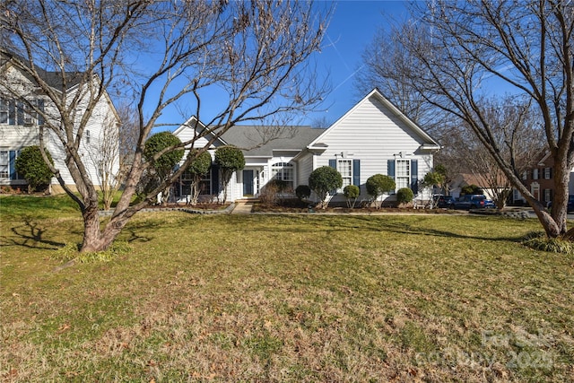 single story home featuring a front yard