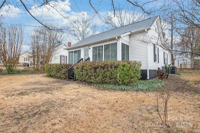 view of property exterior with a yard