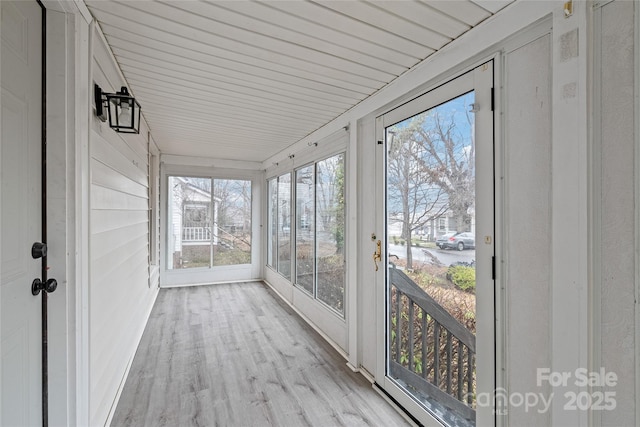 unfurnished sunroom with a wealth of natural light