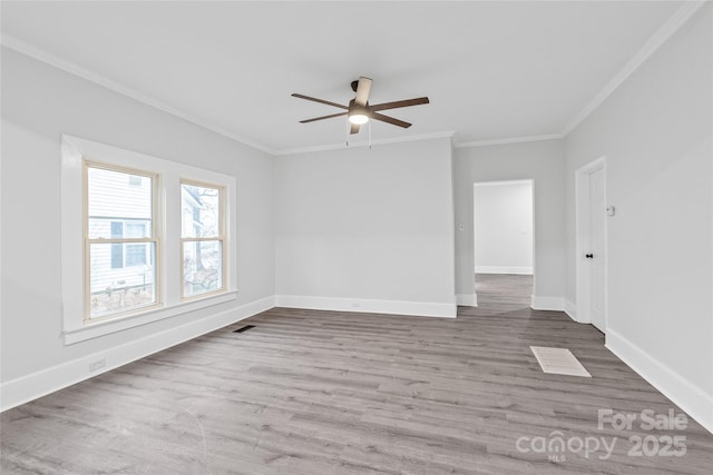 unfurnished room with ceiling fan, ornamental molding, and wood-type flooring