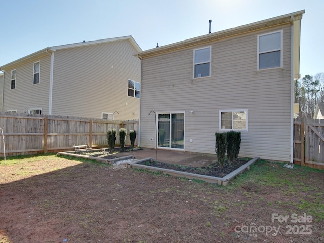 rear view of property featuring a patio area